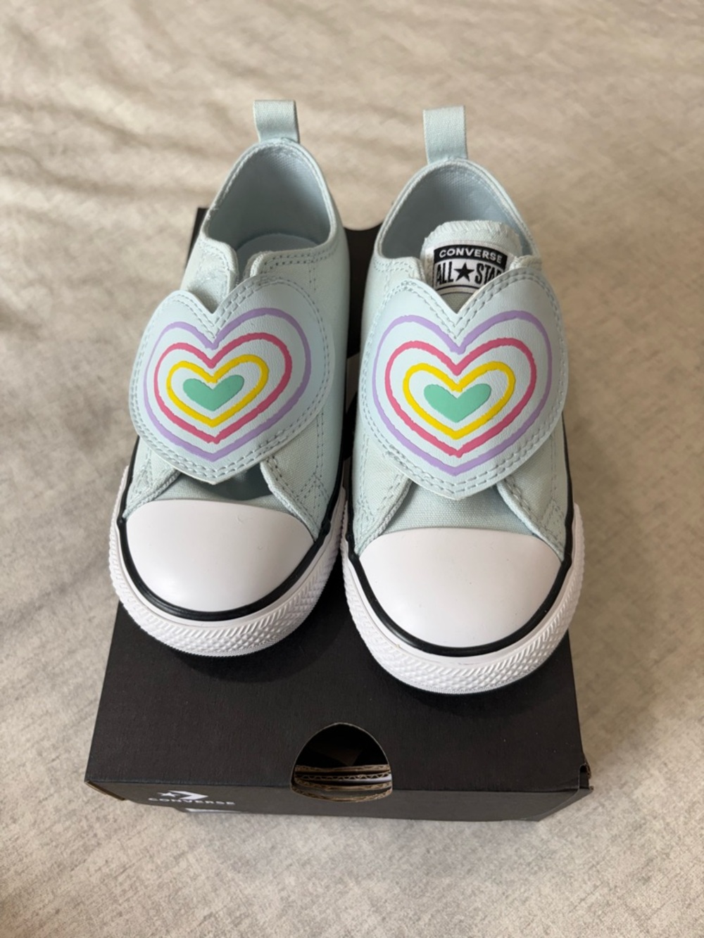 Converse Kids Light Blue Slip-On Sneakers with Rainbow Heart Patches